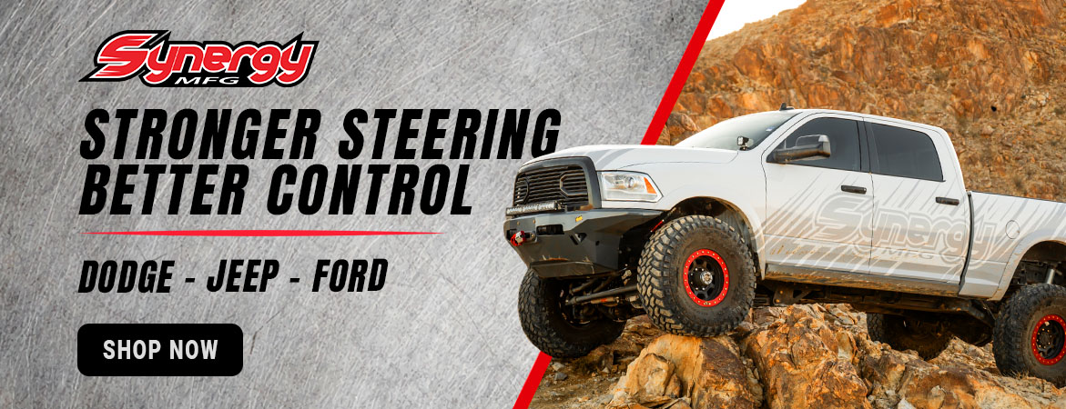 Synergy MFG banner featuring a Ram truck. Shop heavy-duty steering, suspension, and axle upgrades for Dodge/Ram, Ford, Jeep, and other off-road builds.